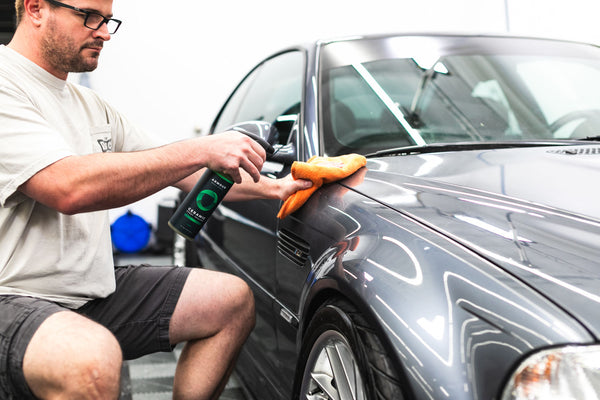 Armour Detail Ceramic 16oz bottle being sprayed onto a grey m3.
