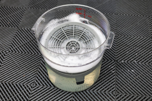 Detail Factory Clean Screen inside of a soapy bucket