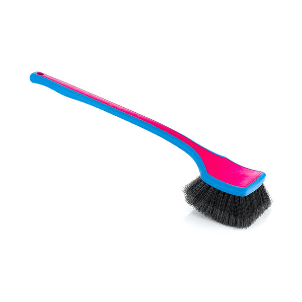 A pink Detail Factory Fender Well Brush on a white background.