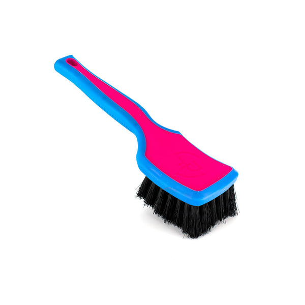 A pink Detail Factory interior Scrub Brush on a white background.
