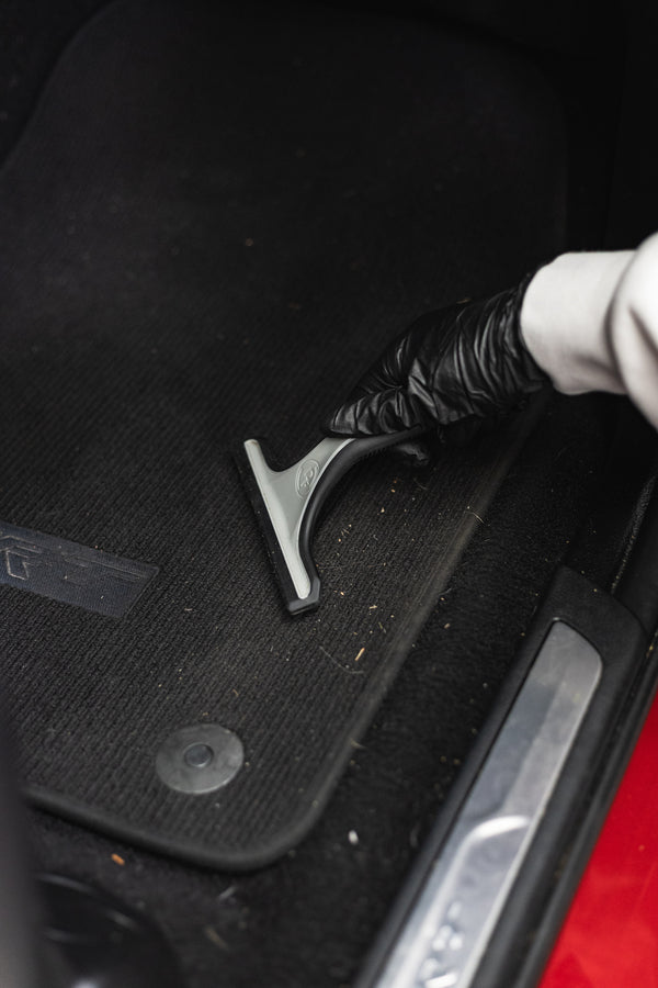 Detail Factory Pet Hair Rake demo on a car matt.