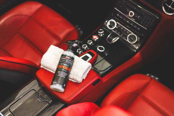 P&S Inspiration Defender laying on top of a microfiber towel inside of vehicle.