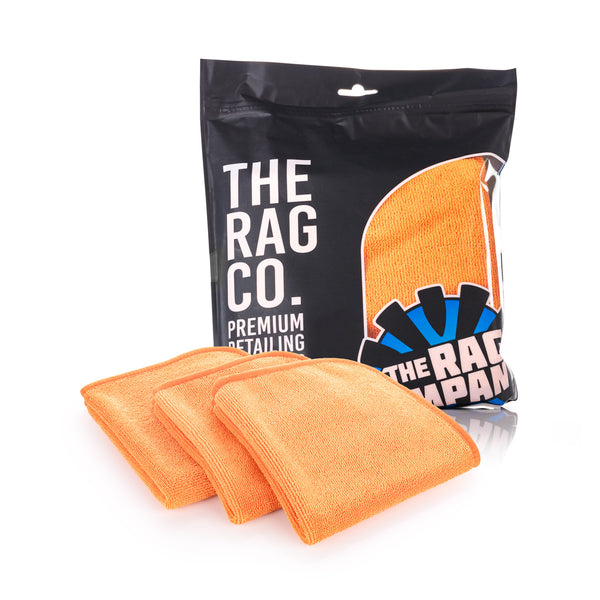Premium FTW 16 x 16 Orange 3 Pack of towels with packaging on a white background.