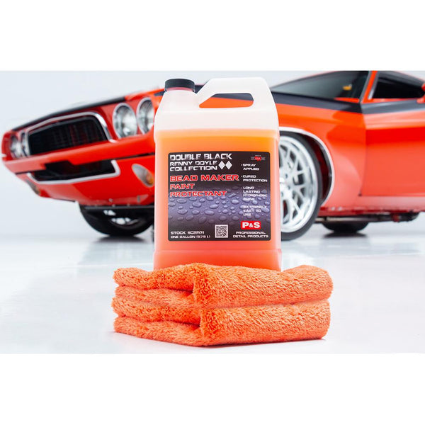 P&S Bead Maker 1 Gallon and Eagle Edgeless Orange Towel stacked in front of a car on a white background.