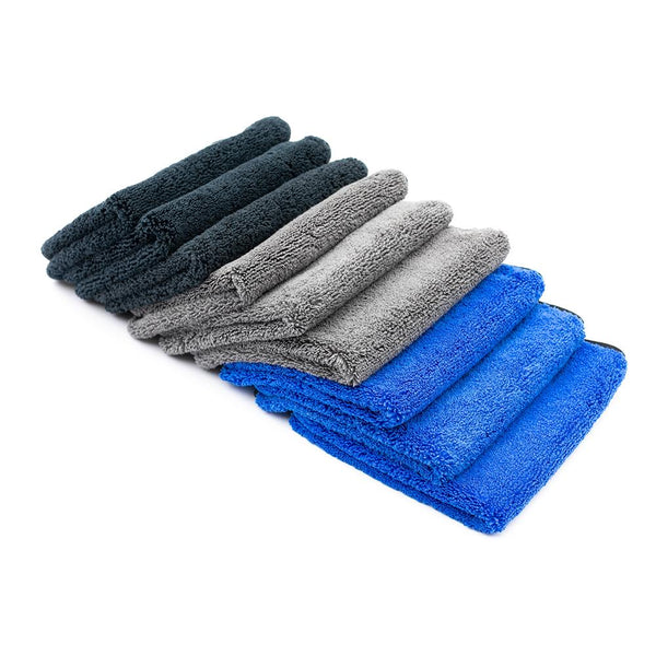 A plethora of Spectrum 420 towels spread across a white background.