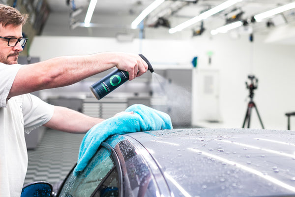 Armour Detail Amplify 16oz bottle being sprayed onto the roof of a grey m3.