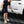 Person cleaning a white Toyota Tundra truck with a Detail Fender Well Brush ectoplasm. 
