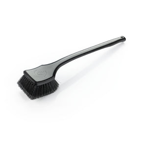 A grey Detail Factory fender well brush on a white background.