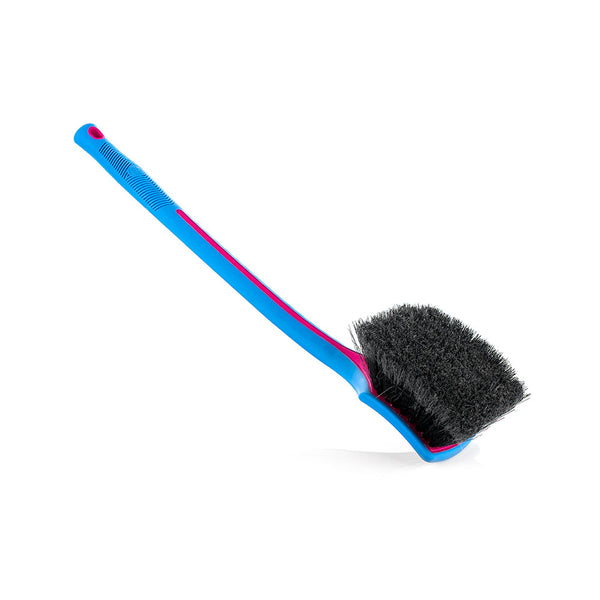 A pink Detail Factory Fender Well Brush on a white background.