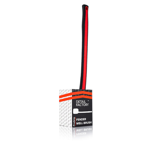 A red Detail Factory Fender Well Brush in its container on a white background.