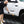 Person cleaning a white Toyota Tundra truck with a Detail Fender Well Brush solar flare. 