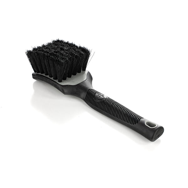 A grey Detail Factory Interior Scrub Brush on a white background.