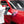 Person applying Armour Detail Amplify to a red car with a pink microfiber towel.