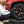 Person cleaning a car tire with Armour Detail Wheel Cleaner with a Detail Factory Curveball brush.