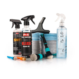 Collection of car care products including spray bottles, cloths, and brushes that make up the Diva Interior Detail Bundle on a white background