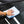 Person cleaning a car window with a light blue 16x24 dry me a river microfiber towel.