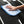 Person cleaning a car window with a light blue 16x24 dry me a river microfiber towel.