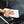 Person cleaning a car window with a white 16x24 dry me a river microfiber towel.