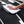 Person cleaning a car window with a white 16x24 dry me a river microfiber towel.