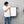 Person holding a white 16x24 dry me a river microfiber towel.