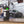iK e Foam Pro 12 on a table with a car in the background.