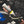 A person pouring fine cut liquid onto a KochChemie Fine Cut Pad attached to a Rupes Polisher.
