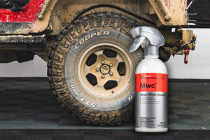 Cooper tire with a bottle of MWC wheel cleaner on a vehicle