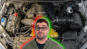 Person standing in front of a car engine with a surprised expression