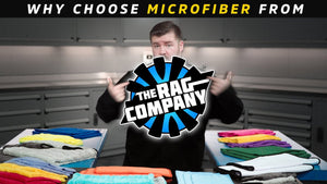 Man holding a logo for 'The Rag Company' with microfiber cloths in the background