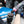 Person pouring P&S Clarity Creme onto a Rupes polisher with a blue car in the background