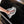 Using a single Rip n Rag multi-purpose microfiber towel from The Rag Company in a grey color to clean the exterior of a black Traeger Grill