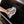 Using a single Rip n Rag multi-purpose microfiber towel from The Rag Company in a grey color to clean the exterior of a black Traeger Grill