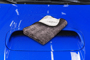 Gauntlet on a blue car hood