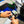 A person adjusting the settings of an Ultra Air Engine Blaster with a blurry background of a car.