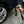 A person using The Rag Company Ultra Air Spray Applicator to clean off a tire.