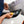 A person using the Yelloplek on a car headlight.