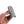 A hand holding the Wrap N' Tuck over a white background.