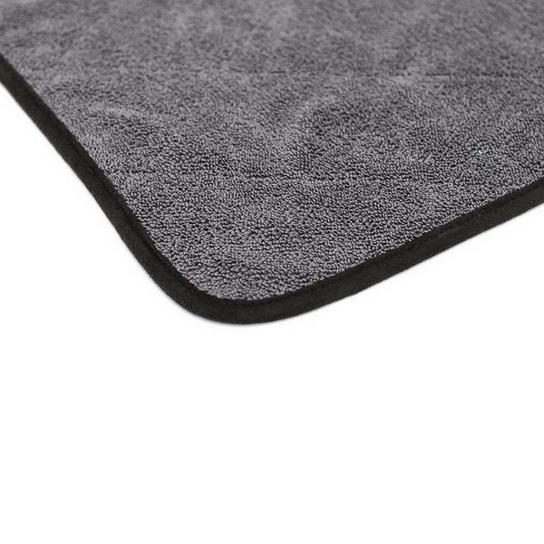 The corner of a grey Double Twistress on a white background 