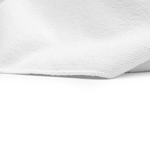 A closeup a white spa and workout towel on a white background.